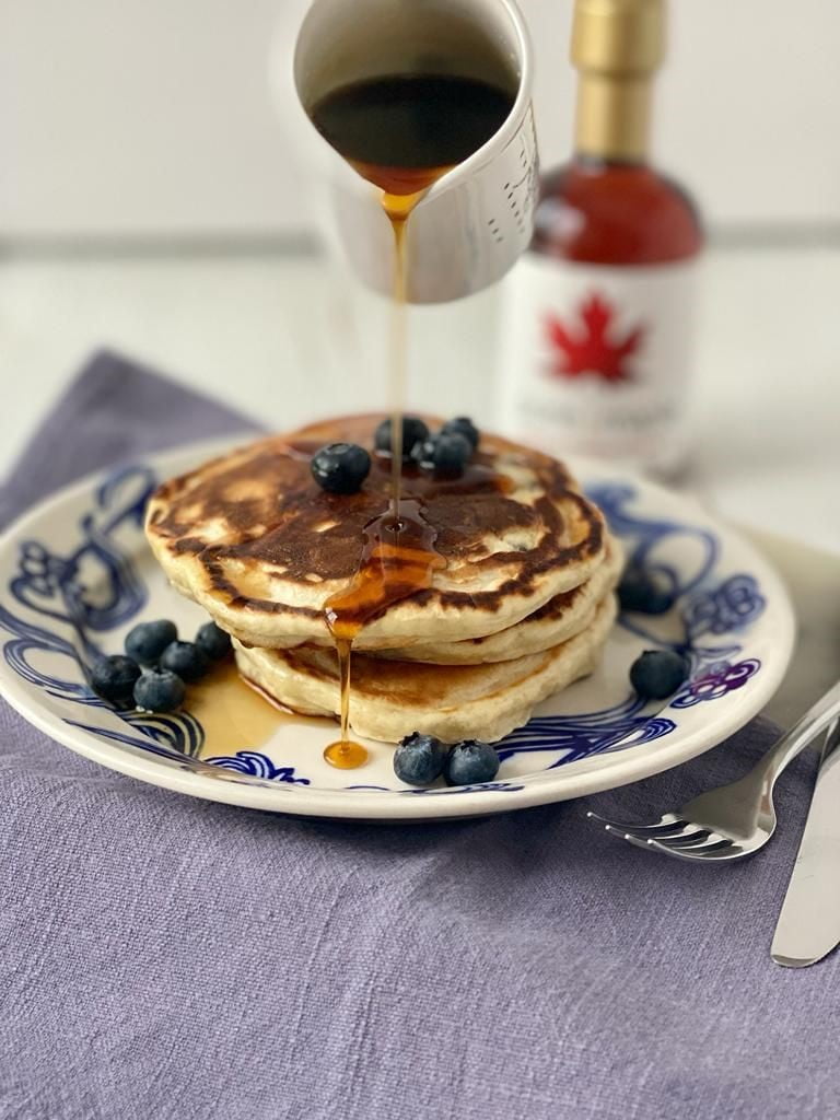 Pouring maple syrup on blueberry pancakes 2 Pure Maple