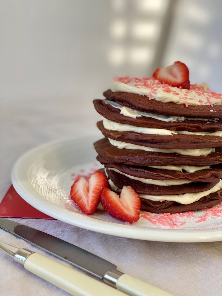 A stack of Red Velvet Pancakes with Maple Cream Cheese frosting Pure Maple